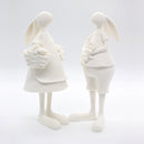 Figura En Piedra Molida De Pareja De Conejos Con Flores